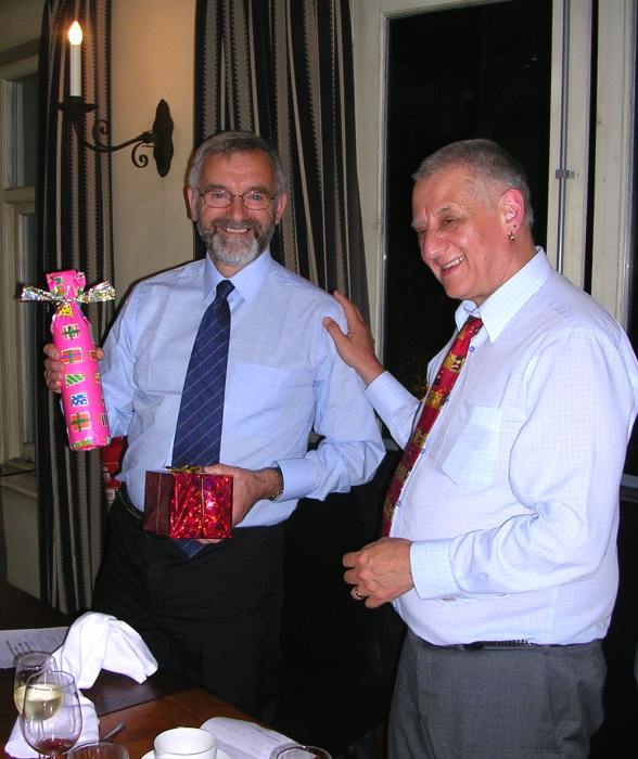 Dr Andrew Taylor presenting gifts to Dr Phil Potts